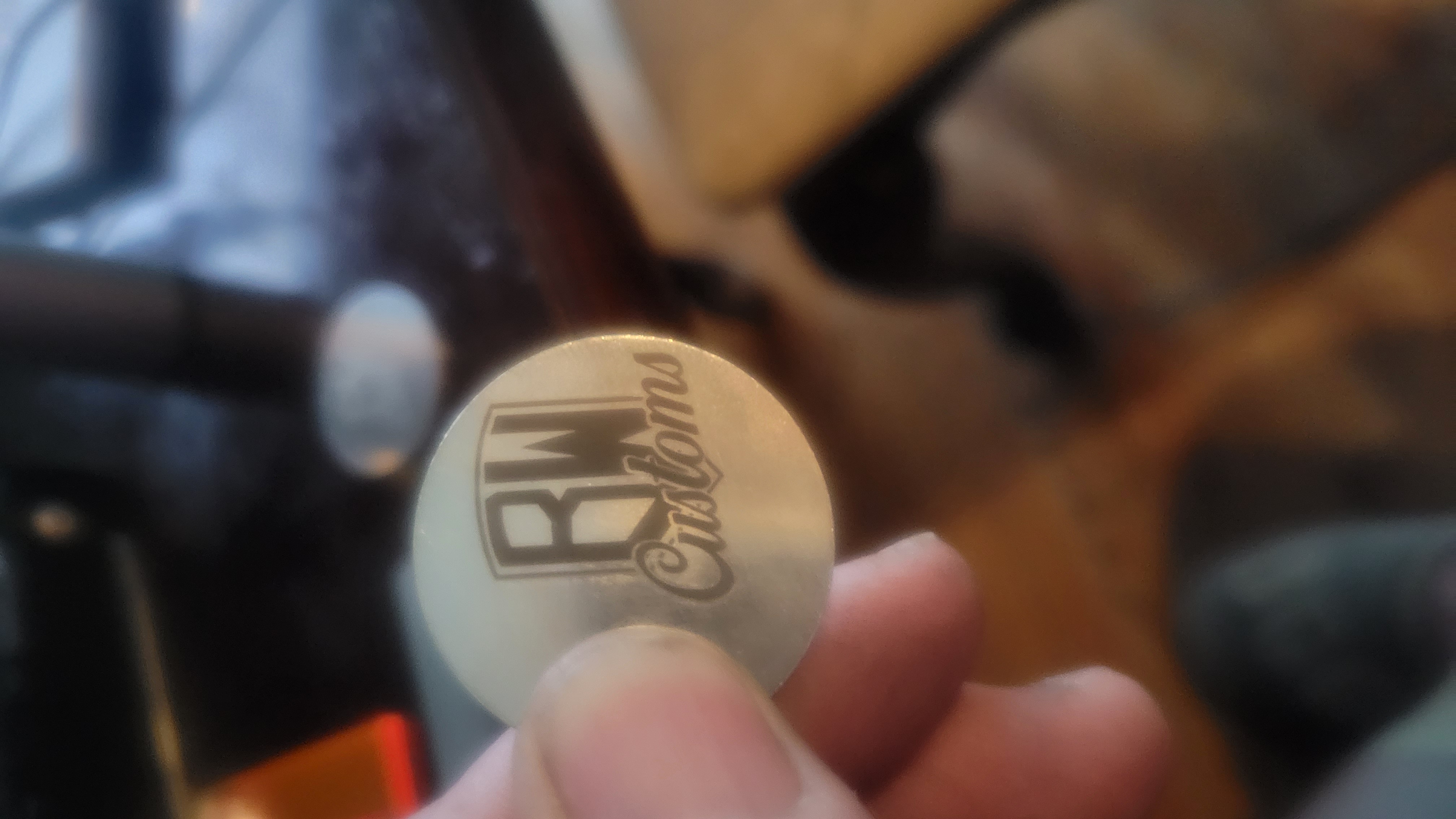 Metal tag with engraved design